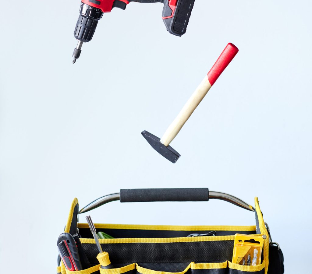 Red and yellow work tools floating in air wallpaper